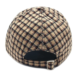 Detail view of the classic brown plaid baseball cap with adjustable silver metal buckle