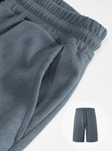 Detail view of men's casual shorts showing elastic drawstring waist and blue-grey fabric