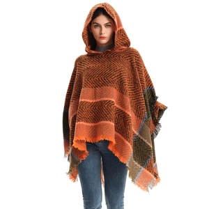 Orange herringbone hooded poncho with plaid patchwork and fringe tassels for women