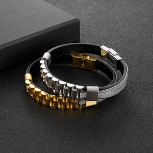 Detail view of gold and silver stainless steel mesh bracelets with watch strap buckle