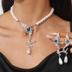 Elegant pearl necklace set with zircon bird pendant and matching teardrop earrings