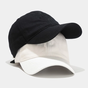 Classic black and beige soft top cotton baseball caps in a minimalist stacked display
