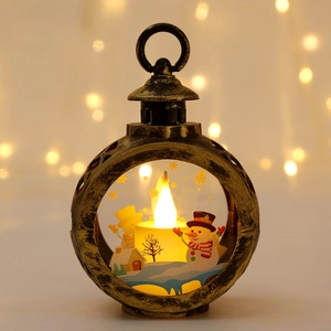 Close-up of retro bronze Christmas lantern with a lit snowman scene inside