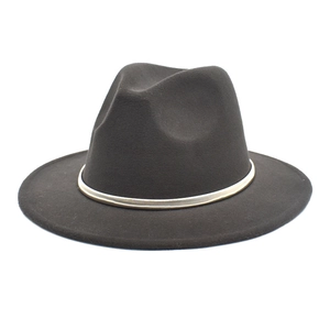 Detail of wide brim wool fedora hat featuring a decorative gold metallic chain band
