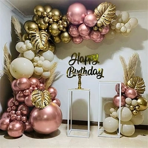 Rose gold and white balloon arch kit with tropical palm leaves for birthday party decor