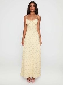 Detail of thin straps and drawstring tie on a yellow floral summer maxi dress