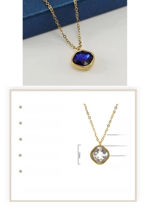 Detail showing 18K gold-plated necklace specs with a blue zircon square pendant