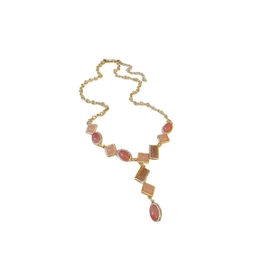 Vintage gold Y-shaped necklace featuring peach gemstones and sparkling diamond accents
