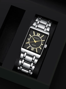 Detail view of square quartz watch with black dial and golden Roman numerals in a box