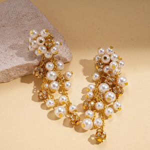 Vintage gold earrings with faux pearls and rhinestones in a floral tassel design