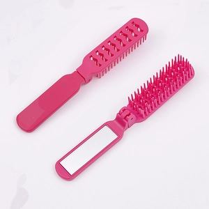 Mini-Haarbürste in Rosérot, faltbar mit integriertem Spiegel, offen und geschlossen