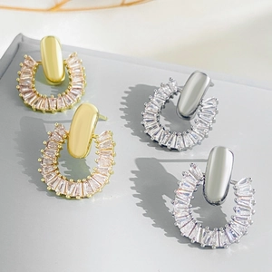 French luxury C-shaped hoop earrings with shimmering zircons in gold and silver finish