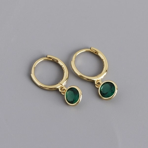 Detail showing S925 hallmark on gold plated sterling silver earrings with green zircon