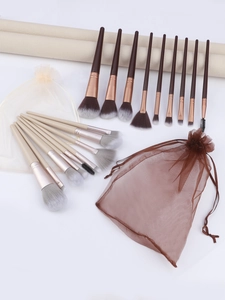 Detail of 9-piece makeup brush set with mesh bag and diverse bristles for beauty care