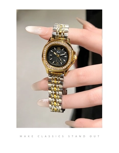 Close-up of diamond-encrusted steel watch bezel with textured black dial on female wrist