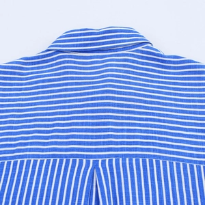 Close-up of blue and white striped shirt featuring the box pleat and fabric texture