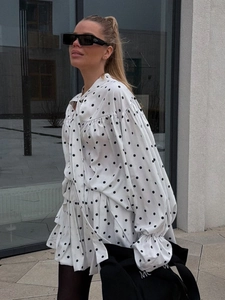 Polka dot blouse and skirt set with bell sleeves and drawstring tie neck in white and black