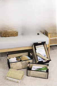 Close-up of foldable hand-woven bamboo storage baskets with wooden handles in living room