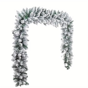 Christmas flocked pine garland with heavy snow effect and pine cones for fireplace decor
