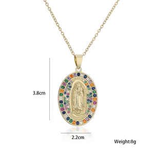 Detail view of gold Virgin Mary pendant with rainbow zircon stones and 3.8x2.2cm dimensions