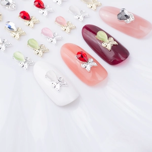 3D cat eye stone bow nail charms with crystal heart and teardrop gems in gold metal