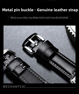 Detail of black leather watch strap with white stitching and polished silver buckle