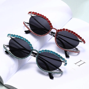 Y2K Cat Eye Sunglasses with hollow frame and colorful rhinestones in red and blue