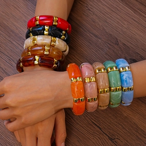 Chic acrylic geometric bangle with colorful marble patterns and gold metal accents