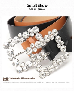 Macro detail of luxury alloy buckle with sparkling crystals on black and brown leather belts