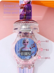 Close-up of Frozen Elsa pink digital watch showing date, time, and glowing LED screen