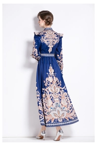 Back view of a long-sleeved vintage paisley print maxi dress in navy blue satin