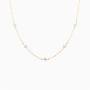 Elegant gold necklace with five light blue zircon flower pendants on a white background