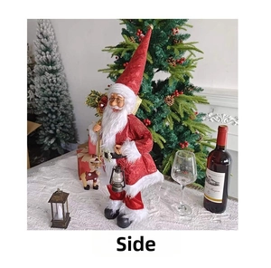 Side view of standing Santa Claus doll in red sequin robe holding a classic lantern