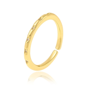 Detail of adjustable gold ring featuring pavé-set zircons with a clear studio reflection