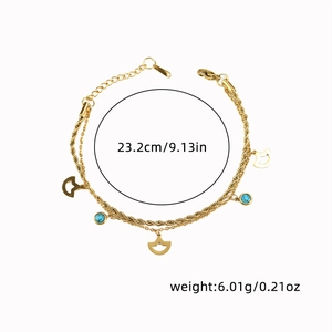 Detailed view of double-layer titanium steel anklet with fan pendant and blue beads