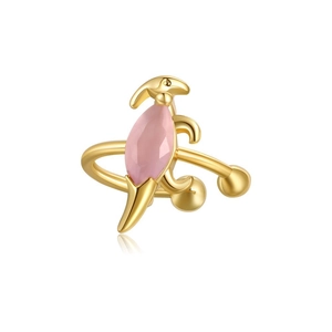 Detailed macro view of 18K gold dinosaur ear cuff with a marquise pink gemstone
