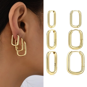 Three sizes of gold geometric U-shaped rectangle hoop earrings for women shown on a model