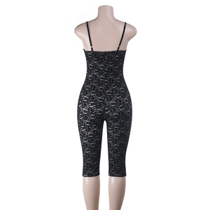 Rear view of black lace jumpsuit on mannequin showing sheer fabric texture and thin straps