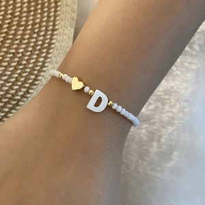 Handmade beaded bracelet with white round beads, golden heart charm and letter D square block