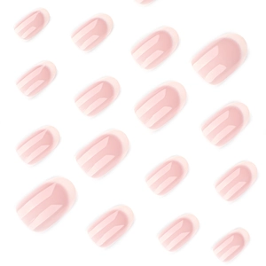 Short round French nails with soft nude pink base and delicate white gradient tips