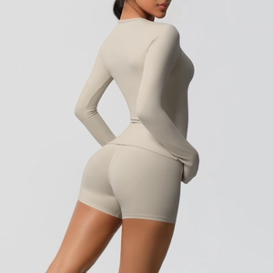 Detail of light beige yoga set featuring double-sided brushed fabric on female model