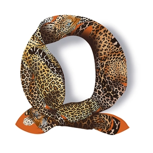 Detail of silk scarf with leopard print and animal motif folded into a Q shape