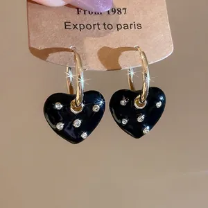 Vintage heart hoop earrings with black enamel and sparkling rhinestones for women