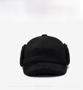 Detailed front view of black trapper hat with warm faux shearling lining and ear flaps