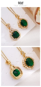 Detail of emerald pendants with pearls and crystals on gold chains with polished back