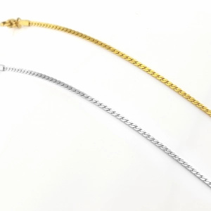 Detailed shot of square link geometric bracelets in gold and silver stainless steel