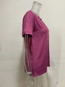 Side view of women's purple V-neck short sleeve T-shirt with side slit on a clear mannequin