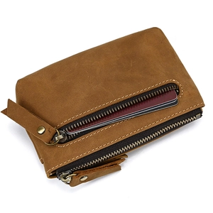Close-up of brown leather coin purse with double metal zippers and credit card slots