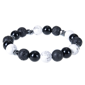 Detail view of handmade 10mm lava rock and tiger eye beaded bracelet with silver spacers