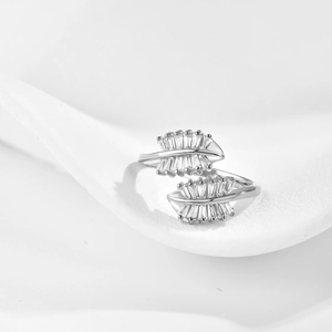 Macro shot of leaf-shaped silver ring with sparkling marquise zircon inlay and detail